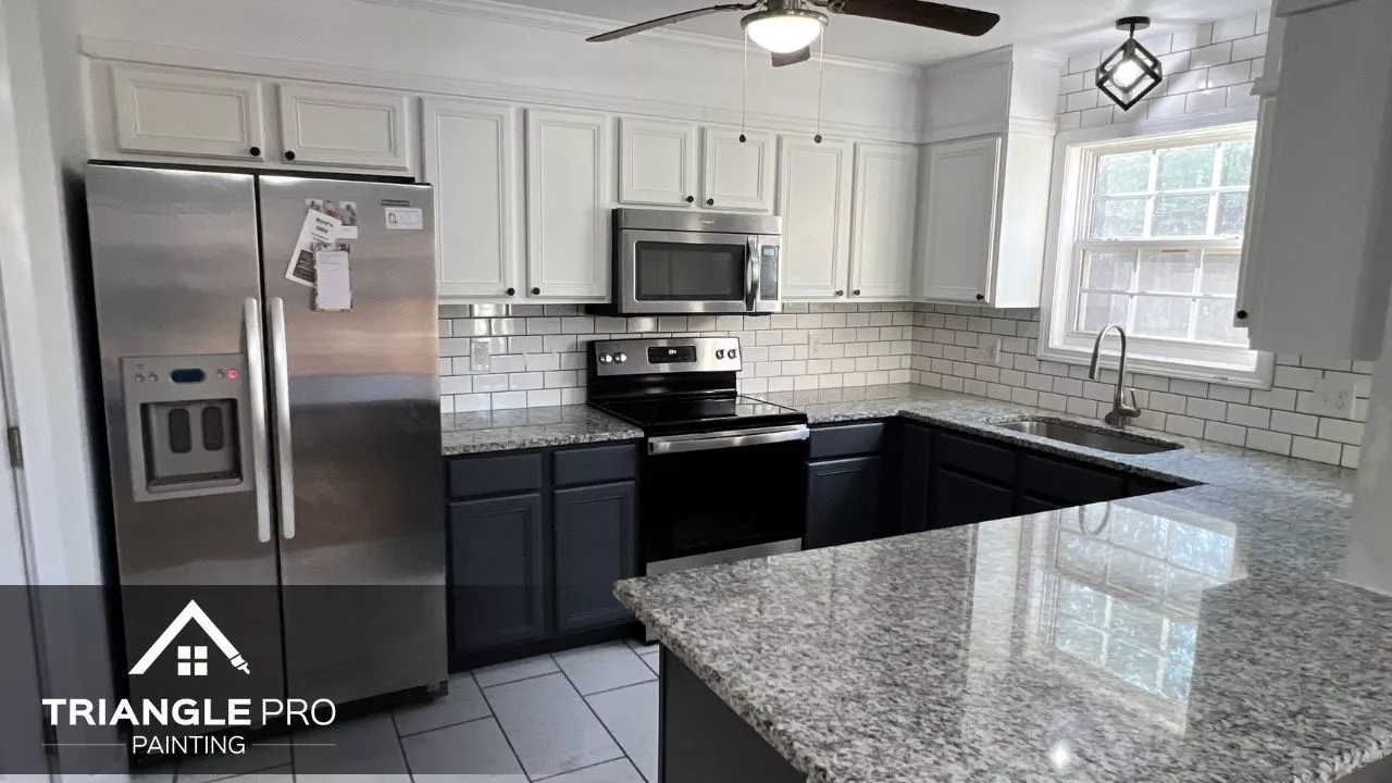 This photo shows cabinet painting in a modern kitchen by Triangle Pro Painting in Boylan Heights Raleigh NC.