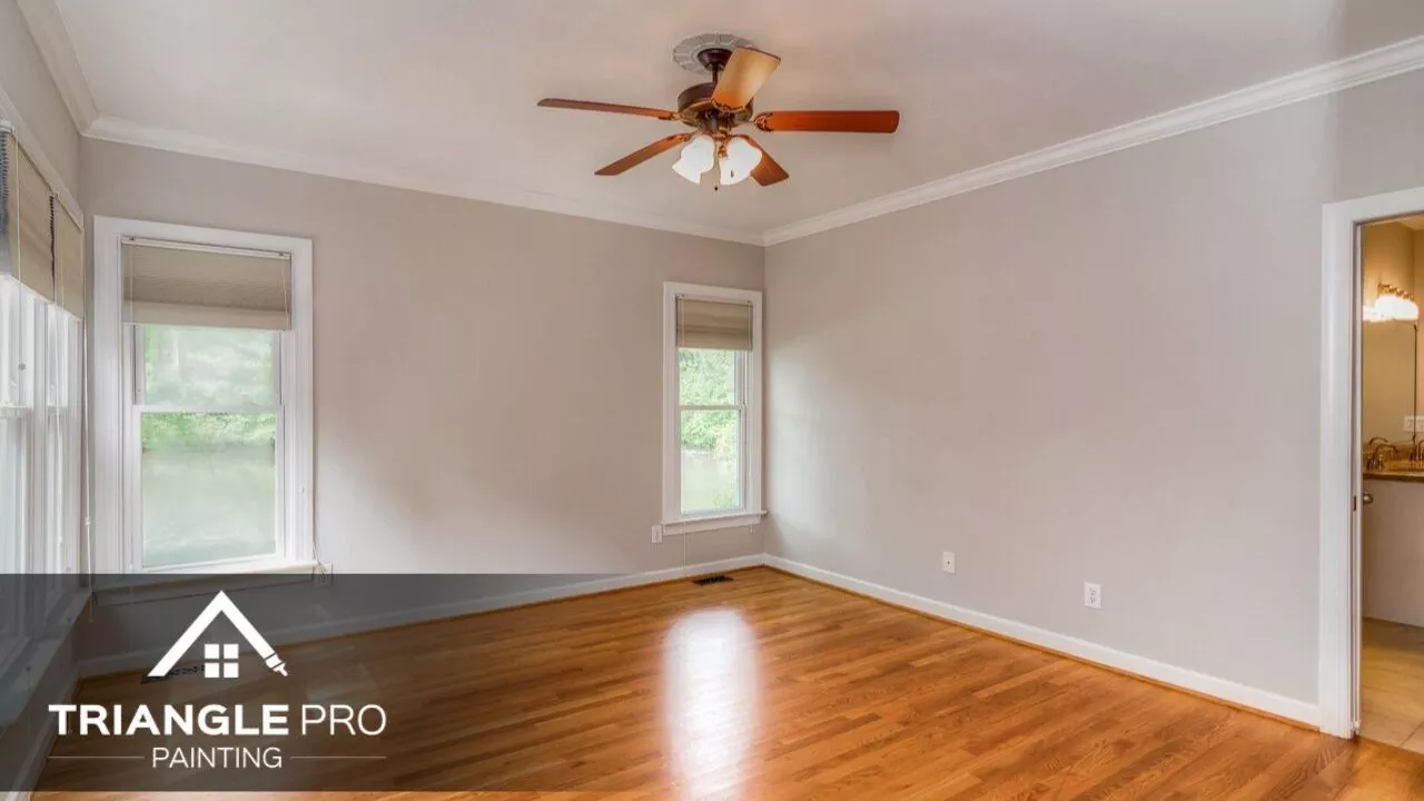 An interior of a house that is painted with white paint.