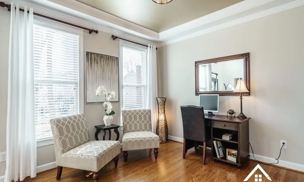 Neutral paint color samples on a wall in a Downtown Raleigh home interior