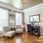 Neutral paint color samples on a wall in a Downtown Raleigh home interior