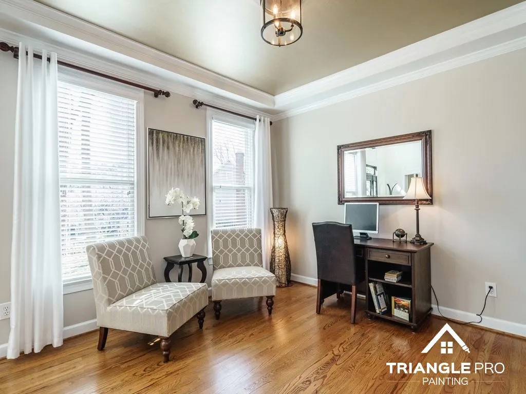 Neutral paint color samples on a wall in a Downtown Raleigh home interior